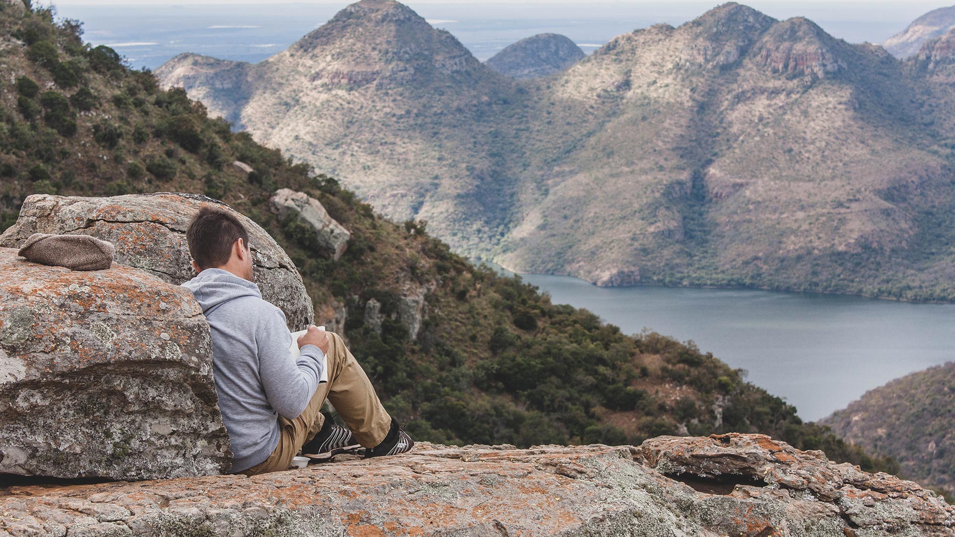 Client sitting on a cliff